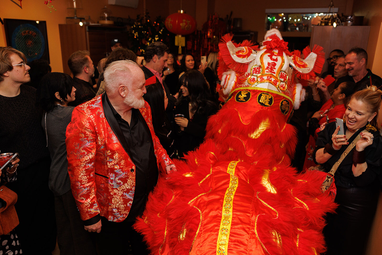 Chef Art admiring the Seven Star Lion Dance performers during his exclusive Chinese New Year party. (Photo by Collin Pierson)